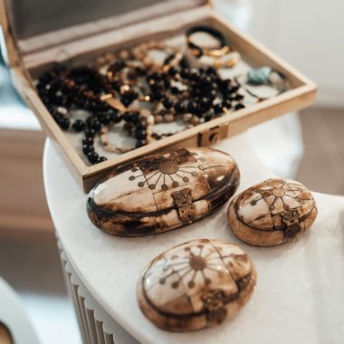 Collection of jewelry in traditional yak bone boxes in store