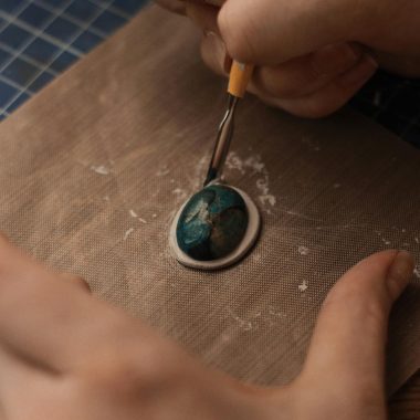 Hands of a Person Using Cutter on a Gemstone