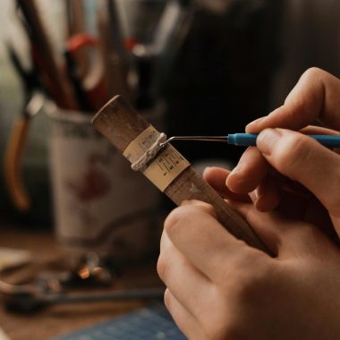 Person Holding Blue and Silver Hand Tool